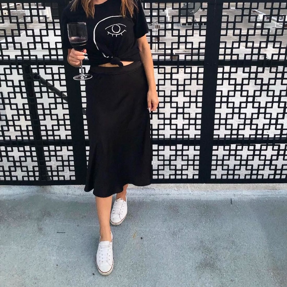 “Something Navy” black satin midi skirt